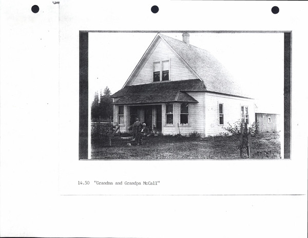 Photocopy of “Grandpa and Grandma McCall” in front of a house. Image contains the text: "14.50 Grandma and Grandpa McCall"