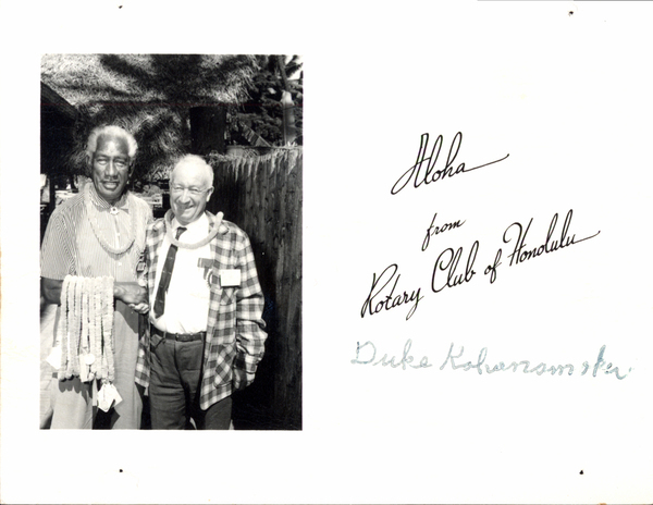 Bill Deinhard or Willaim Deinhard with Duke. Image contains the text: "Aloha from Rotary Club of Honolulu Duke Kahanamoku"