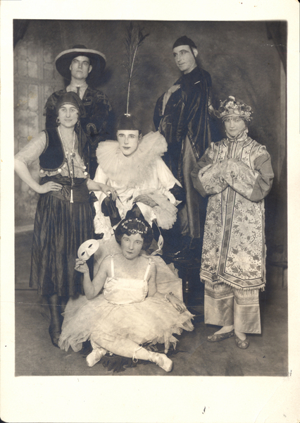 Six individuals in costumes