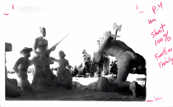 An ice sculpture of a family. Image contains the text: "p 4 Shoot 100% Frontier Family"