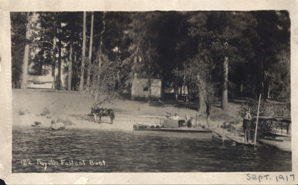 Original postcard with a photo of 122. Payette Fastest Boat, in view is the beach, a boat in the water, and a horse tacked up. Image contains the text: "122 Payette Fastest Boat   SEPT 1917"