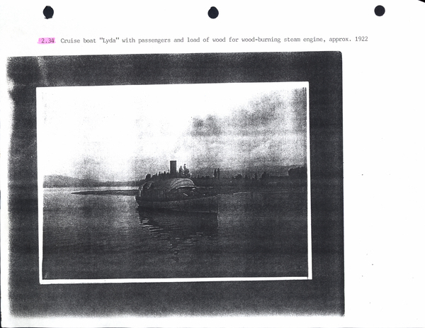 Photocopy of the cruise boat “Lyda” with passengers and load of wood for wood-burning steam engine. Image contains the text: "2.34  Cruise boat "Lyda" with passengers and load of wood for wood-burning steam engine approx. 1922"