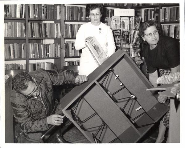 Moving to the new library, Christmas Party, there is Mayor Don Boos, Librarian Eva Neisinger, Assistant Doris Bruce