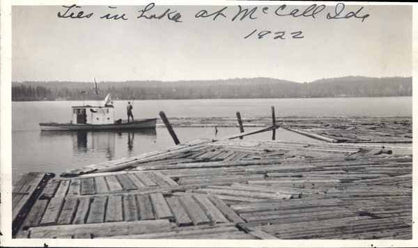 Photocopy of ties in lake will a mill boat. Image contains the text: "Ties in Lake at McCall Ida 1922"