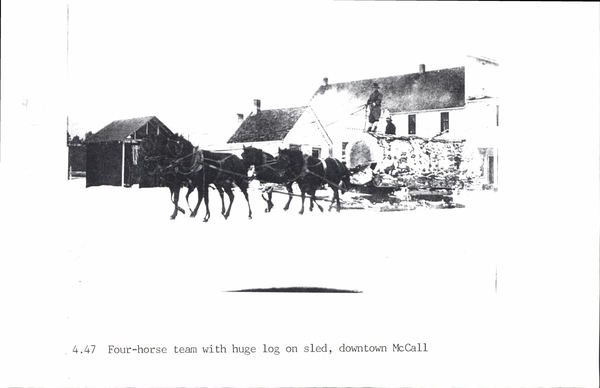 Photocopy of four-horse team with huge log on sled, downtown McCall. Image contains the text: "4.47 Four-horse team with huge log on sled downtown McCall"