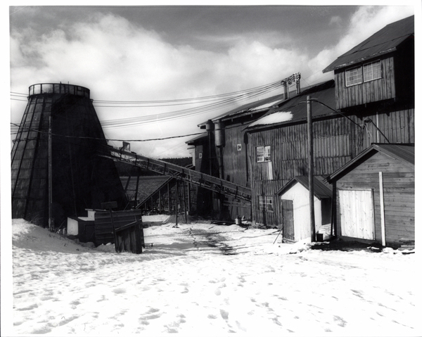 Mill during the winter. Image contains the text: "There is no discernible text in the image provided."