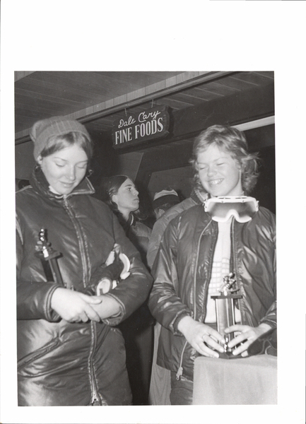 Two girls with their trophies, left- Tanya Welch, right-Thea Deul. Image contains the text: "Dale Cary FINE FOODS"