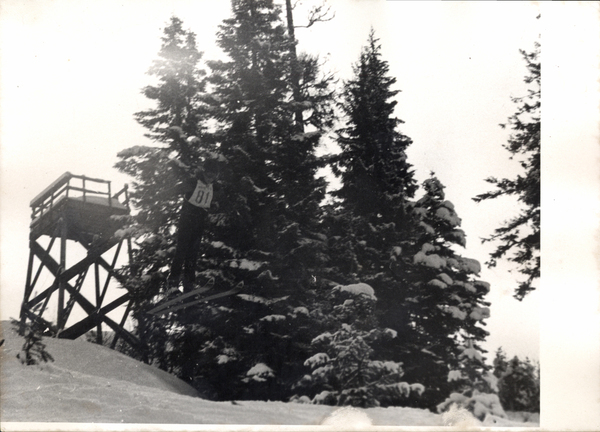 A ski jumper going through a ski jump at Little Ski Hill