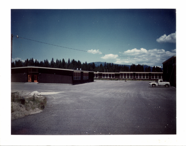 McCall Donnelly Highschool building with an ealry truck in the parking lot