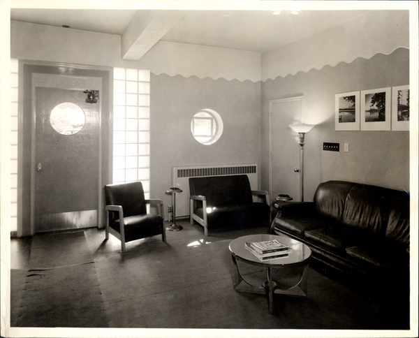 Inside of the Yacht Club in the lobby with couches and a coffee table