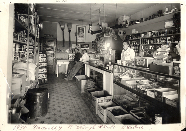 Donnelly- interior store with McDougal, S. Strode, O. Wallace. Image contains the text: "1932 Donnelly T. McDougal & Steele O Wallace"