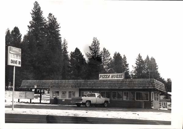 Lardo Pizza House in view is the building with a early pickup. Image contains the text: "Coca Cola   DRIVE IN    PIZZA HOUSE"