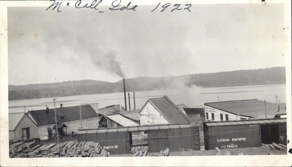 McCall, Idaho 1922, train loading ties, view of early buildings (perhaps the sawmill). Image contains the text: "McCall Ida 1922  UNION PACIFIC  NO 79414  PAYETTE LAKES ELEVATING COMPANY"