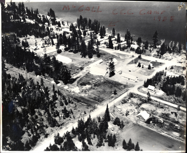 Forest Service Headquarters with CCC Camp in the background. Image contains the text: "MCCALL C.C.C. CAMP 1938"