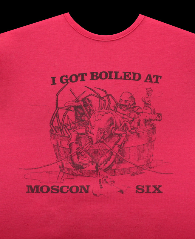 The official MosCon VI shirt, featuring an image of a large lobster being boiled in a tub. Beneath the image reads "I got boiled at Moscon six."