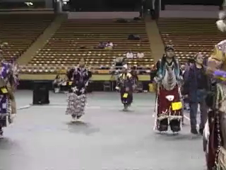 Tutxinmepu Powwow on the University of Idaho campus, October 2001 - Strips and Feathers: the Veteran and the Whip Woman.