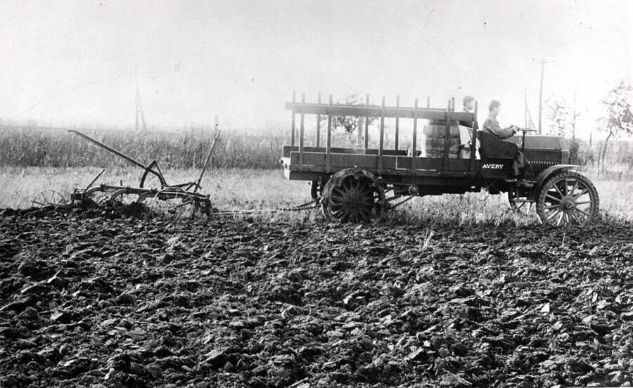 Avery truck converted into a tractor pulling a three bottom plow. Picture courtesy T.B. Keith.