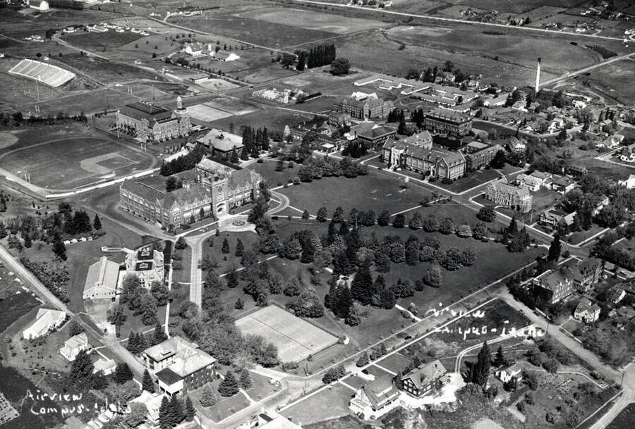 Looking northwest at the University of Idaho buildings about 1938. Picture by Hodgins. Moscow-Pullman Highway extreme top right.