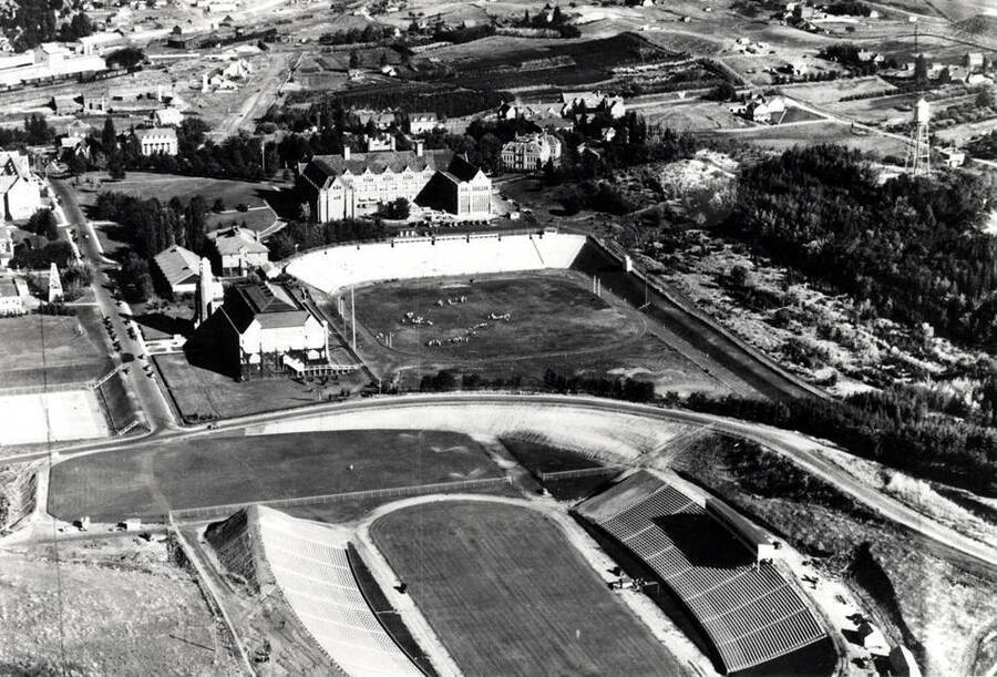 Looking east at University of Idaho buildings about 1938. Neale Stadium in foreground. Picture by Hodgins. Charles Dimond photographer.