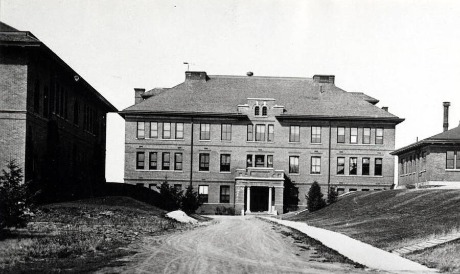 Looking north at Morrill Hall, later Forestry Building, built 1906. Mines Building at left and Geology Building at right. Pine Street between.
