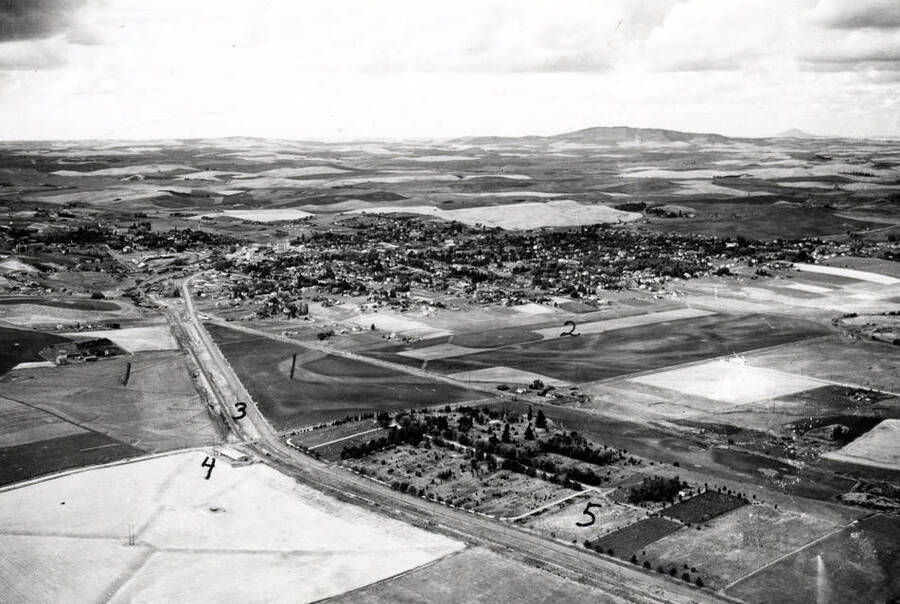Looking northwest at Moscow. Picture by Hodgins in 1938. 1- Skattaboe farm, 2- Frank White farm, 3- Northern Pacific Railroad, left and Highway 12, right, 4- Ed Kitts' potato cellar, 5- Moscow Cemetery. Charles Dimond photographer for Hodgins Drug Store.