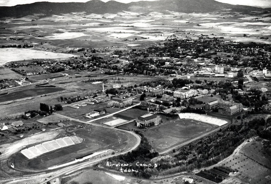 Looking northeast at the University of Idaho campus with Moscow and the Moscow Mountains in the background. Hodgins photo about 1938.