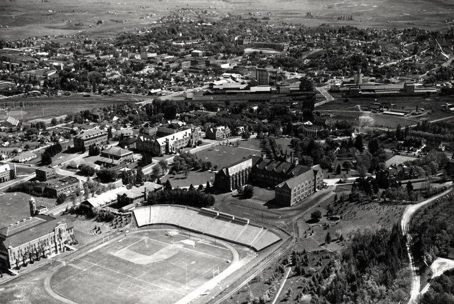 Looking northeast at the University of Idaho campus with Moscow in the background. Picture by Hodgins about 1938.