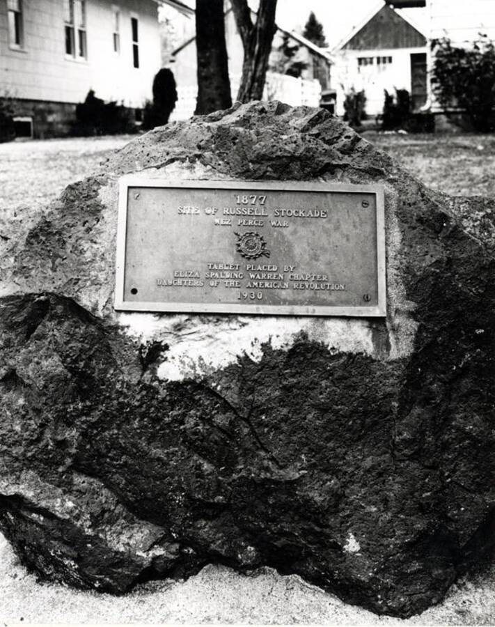 Marker on north side of B Street in front of 810 East B Street. Mr. Anderson reported finding remnants of the Russell Stockade while digging in his garden north of his house. Picture 1975 by Clifford M. Ott.