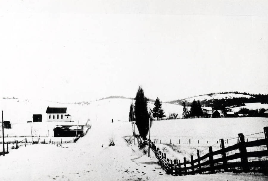 John L. Naylor farmstead at right. Naylor School at left. Picture taken late 1920s or 1930s.