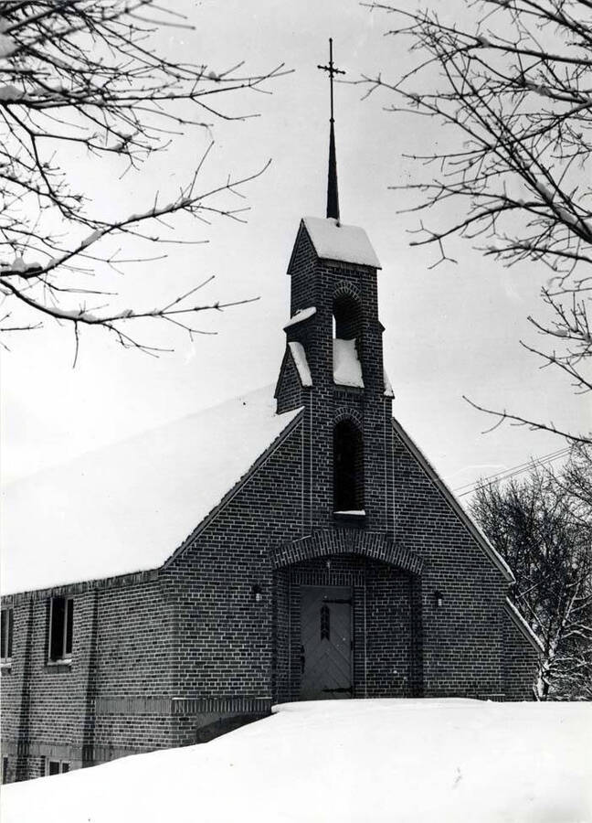 New St. Mark's church built after the fire of 1938 that destroyed the first church. Picture [taken] in the 1940s by Hodgins after a heavy snow. Church located at the southwest corner of First and Jefferson streets.