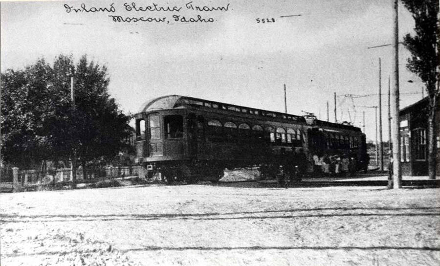 Spokane & Inland Electric Railroad passenger train leaving Moscow. Looking north across A Street from Almon Street. Depot at right. See picture 90-9-061.
