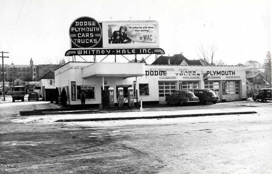 Southeast corner of Fourth and Washington streets. Whitney-Hale Inc. Dodge, Plymouth dealers and service station operators. Late 1940s.