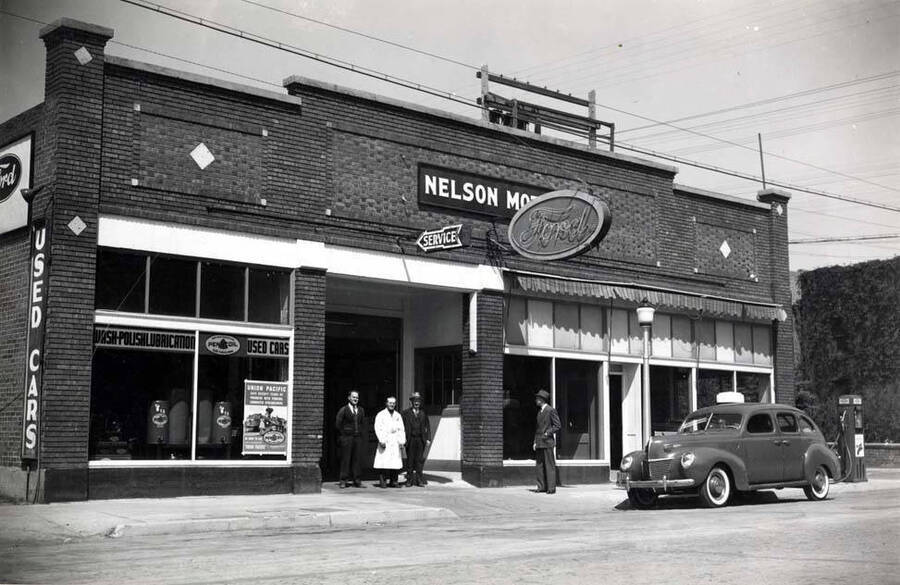 North side of Third Street between Main and Jackson streets west of the alley about 1940. Nelson Motor's Ford dealer.