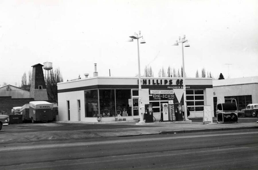 West side of Main Street between A and B streets in the south part of the block. Phillips 66 service station about the 1950s.