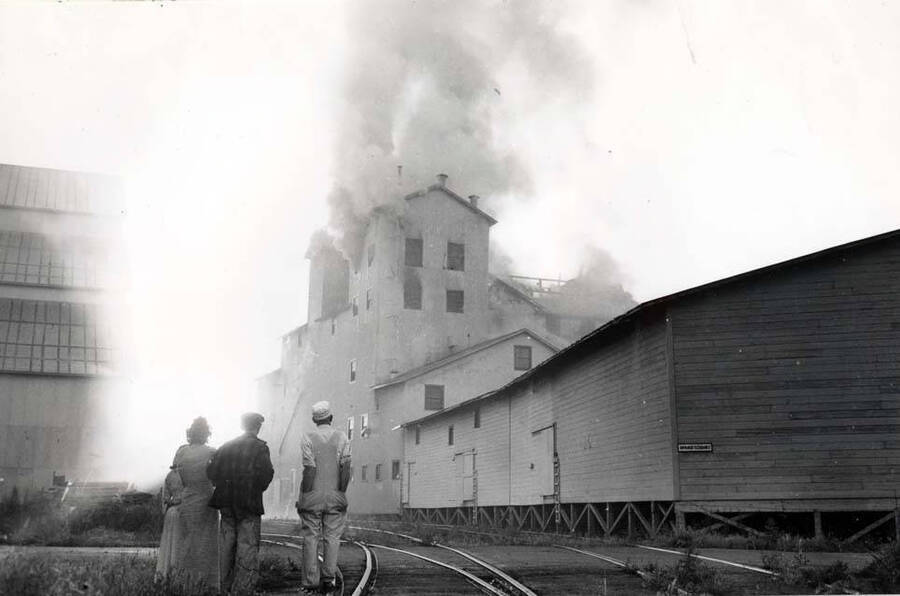 Looking at the west end of the Washburn-Wilson Seed Company plant during the fire of July 7, 1945. [Charles] Dimond, photographer.