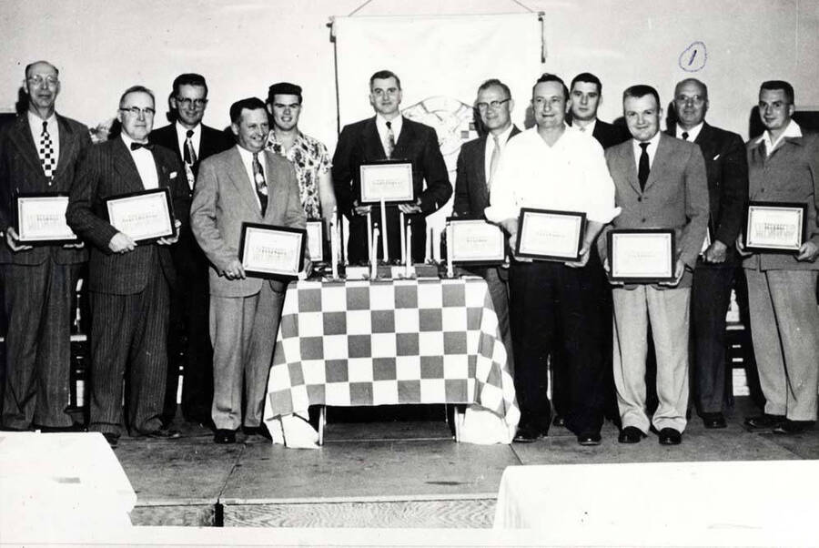 Salesmanship awards presented to the Purina Store managers or salesmen for completing training school, Spokane, Washington 1956. 1- Clifford M. Ott.