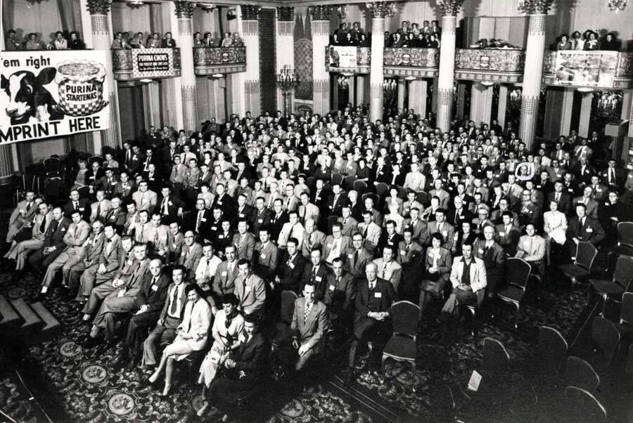 Western Division Purina dealer meeting at San Francisco, California in 1956. Clifford M. Ott in white circle.
