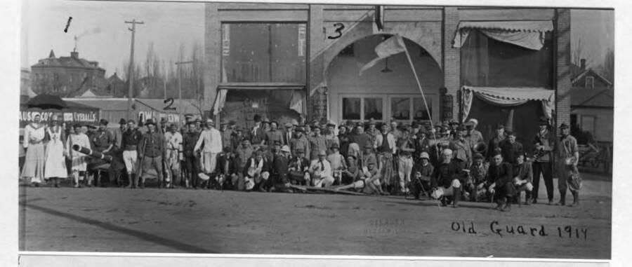Old Guard [Grand Army of the Republic?] in front of No. 3 Crystal Theater at 508 South Main Street. No. 1, first high school; no. 2, drive-in stable between Fourth and Fifth streets on east side of Washington Street. Pacific Coast Elevator Company, dealers in grain, occupied the room at left in the Crystal Theater building. Picture 1914.