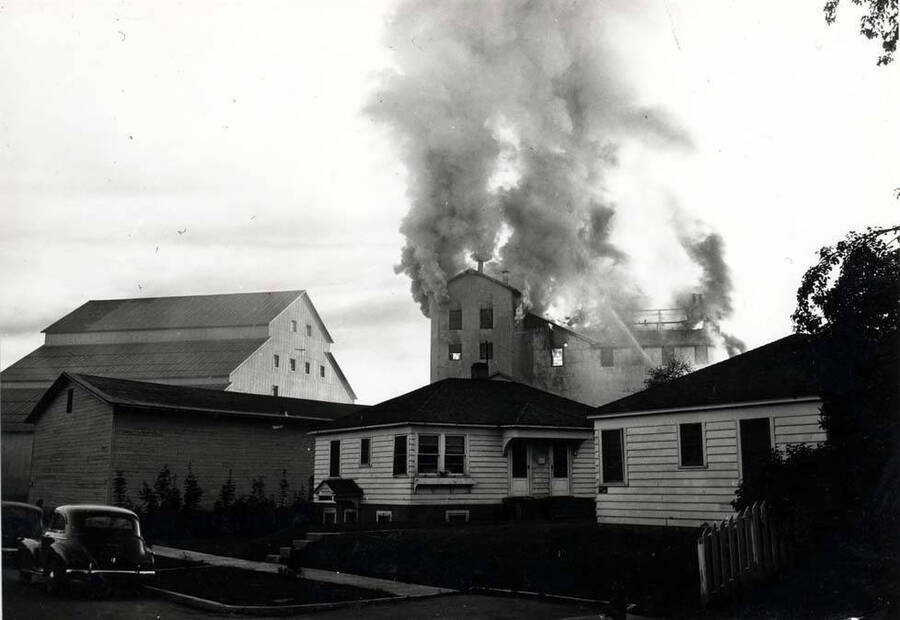 Looking northeast at the Washburn-Wilson Seed Company fire from Asbury Street, July 7, 1945.