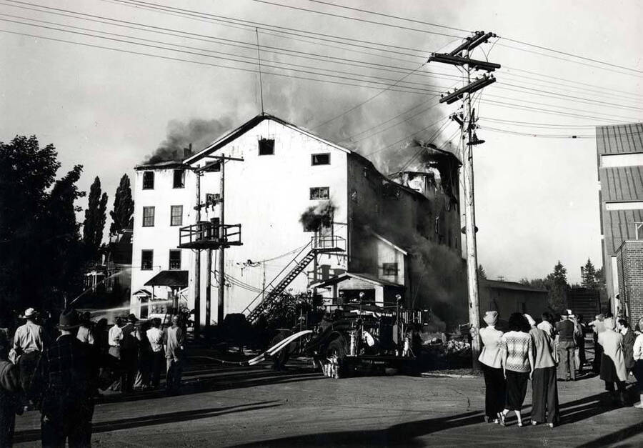 Looking southwest from A Street at the Washburn-Wilson fire. July 7, 1945.
