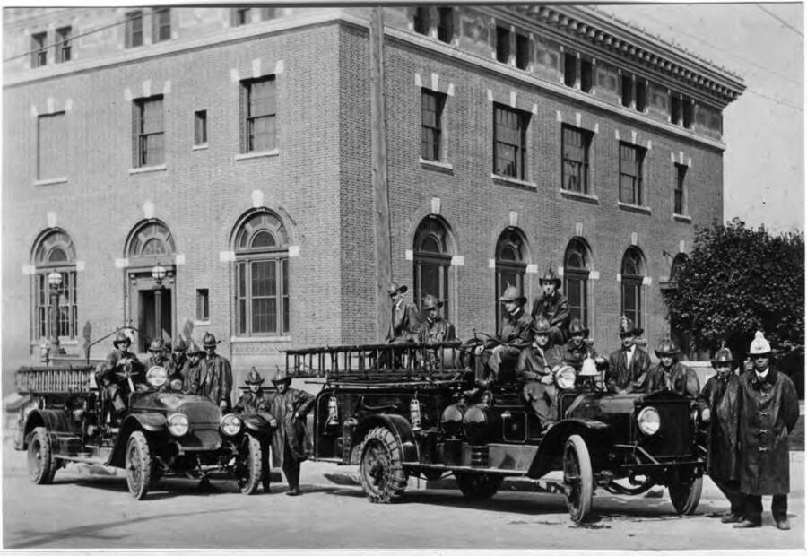 Moscow Fire Department's firemen and trucks facing east on Third Street in front of post office. About 1927.