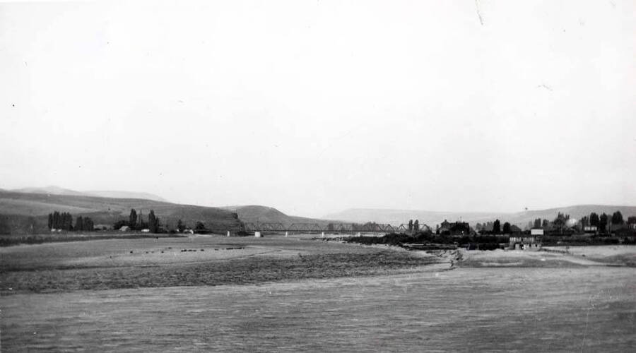 Looking east at the junction of the Snake and Clearwater rivers. Snake River in the foreground and Oregon Railroad & Navigation Company bridge across the Clearwater River in the distance. Picture 1910.