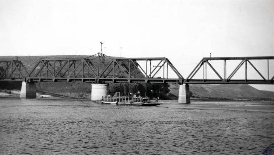 Close-up view of the Oregon Railroad & Navigation Company bridge across the Clearwater River with the Fifth Street ferry in the center of the picture. See [90-10-010] for location of the Fifth Street ferry. Picture taken about 1910.
