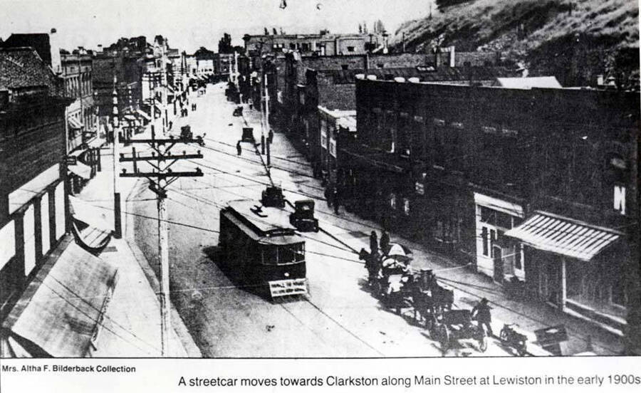 [Caption on photo:] 'A street car moves toward Clarkston along Main Street at Lewiston in the early 1900s.'