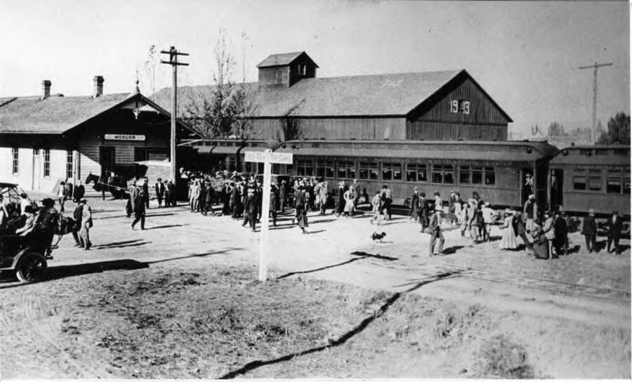 Arrival of W.S.C. [Washington State College] Football Team and Rooters at the U.P. [Union Pacific] Depot October 19, 1911. Photo by Burns. Moscow, Idaho