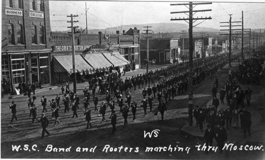 W.S.C. Band and Rooters marching thru Moscow