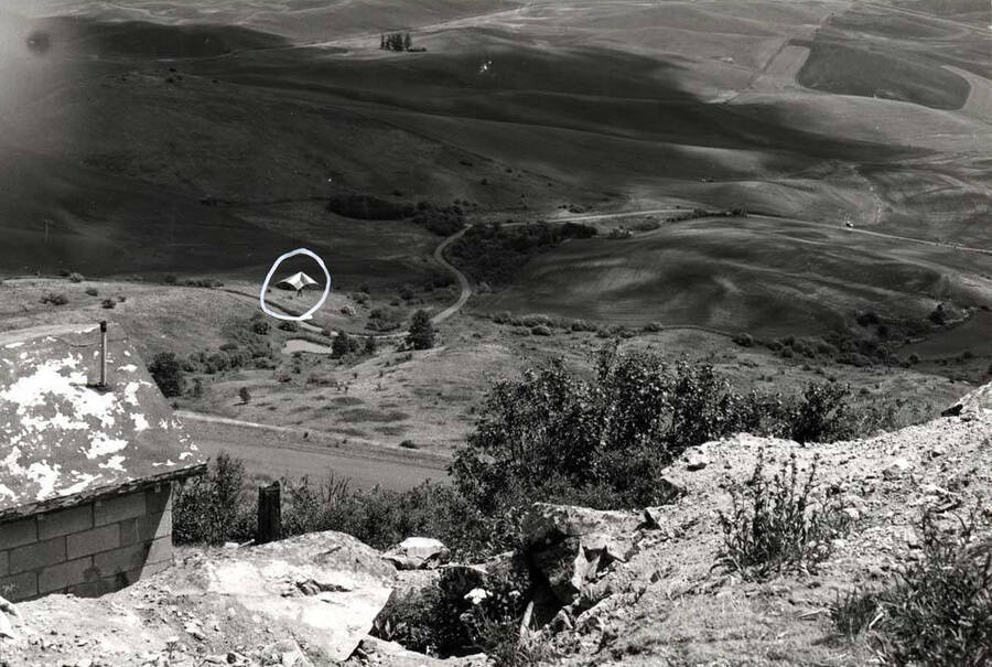 Took off from roadway near top of Steptoe Butte and will land near recreation area at foot of butte. 1975.