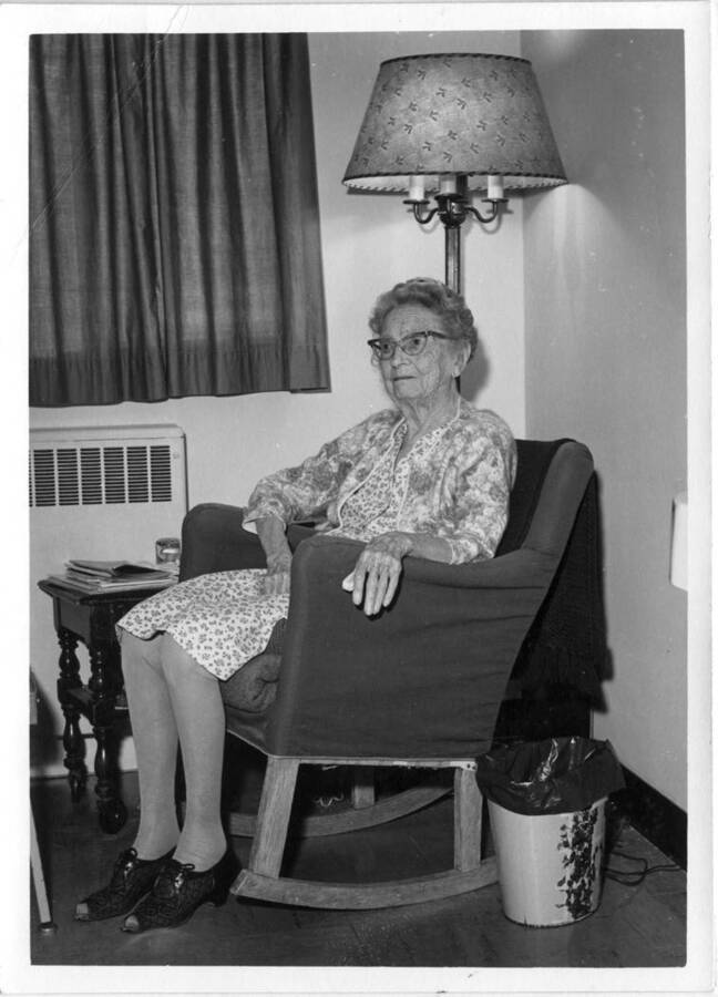 Lily [Lillie] Lieuallen Woodworth, daughter of Almon Asbury Lieuallen, born in Latah County in 1874, who has continuously been a resident of Moscow and now lives at the Latah County Nursing Home. Picture taken January 24, 1969, by Clifford M. Ott.