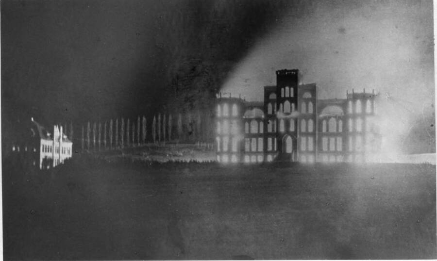 University of Idaho Administration Building burning at night of March 30, 1906. The building at left is the old School of Mines.