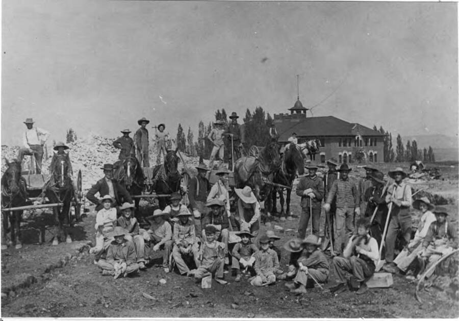 Clean-up crew who cleaned the brick after the walls were demolished. Roy Stillinger and Harry Sampson are among the youngsters in the foreground.